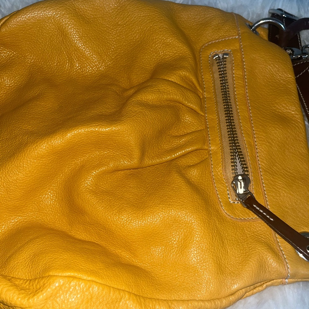Roots yellow leather bag.